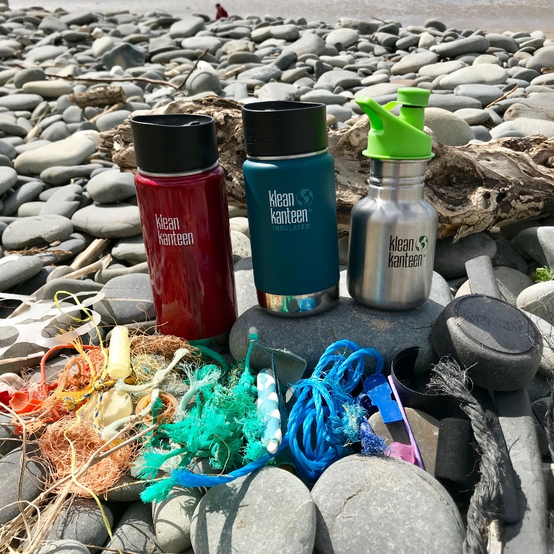 A rainbow of plastic waste found during a 2 minute beach clean, next to our reusable Klean Kanteen bottles